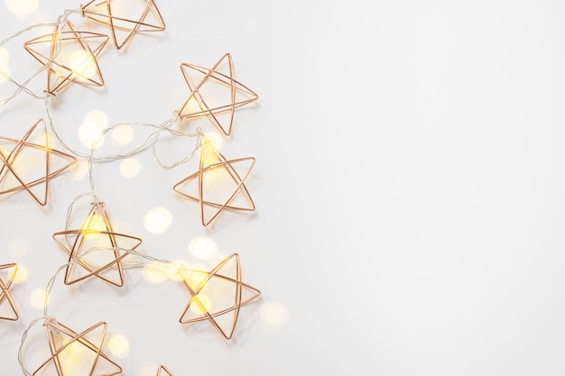 Christmas star shaped light garlands on white background