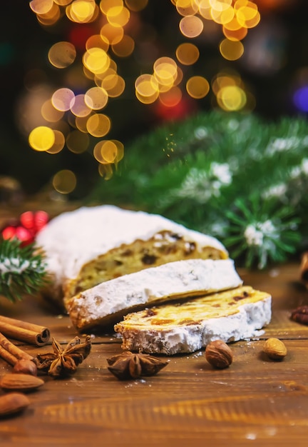 Christmas stollen on wooden background. selective focus.holoday