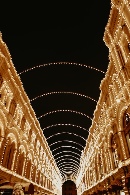 Christmas street of Moscow Evening festive golden lights New Year mood and atmosphere