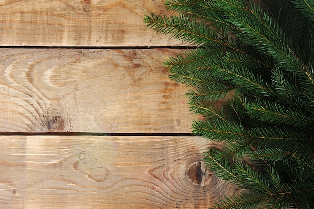 Christmas surface  with Christmas tree on wooden surface