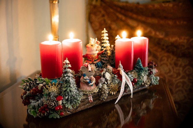 Christmas table composition. Beautiful decoration. Christmas trees, candles, stars, lights and elegant accessories. Merry Christmas and Happy Holidays, Template.