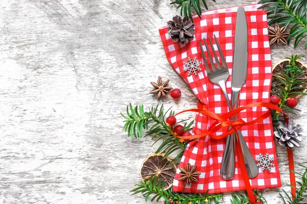 Christmas table place setting with festive decorations