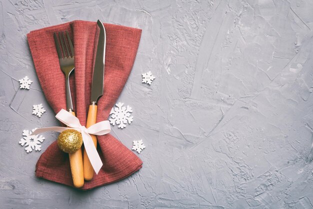 Christmas table place setting with knife napkin and fork Holidays new year background with copy space