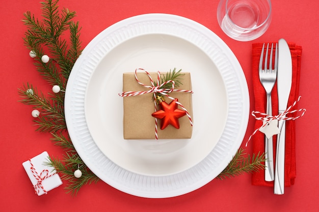 Christmas table setting on red