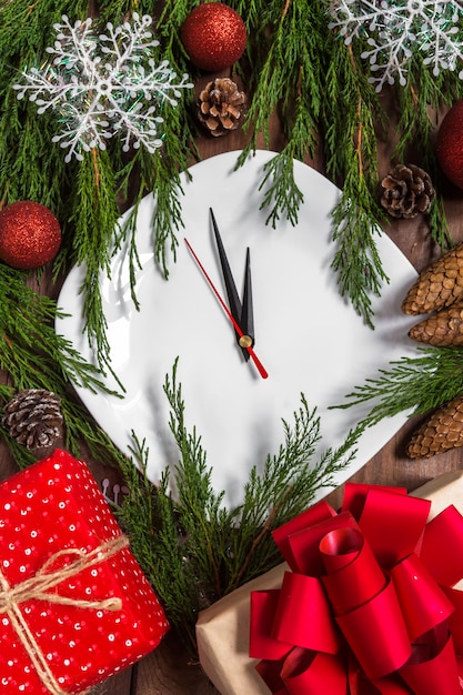 Christmas table setting with plate, silverware and decorations