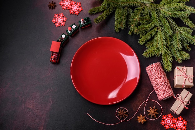 Christmas table with empty plate and surface with New Year's decorations