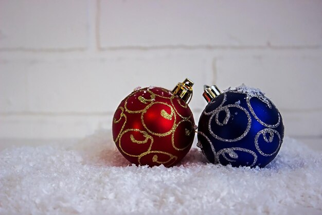 Christmas toys on a light background in artificial snow