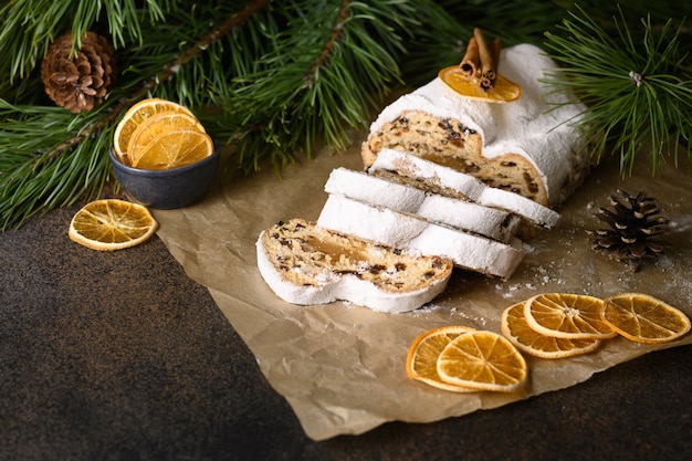 Christmas traditional stollen  german fruitcake on brown