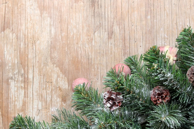 Christmas tree background with decorations on wooden board