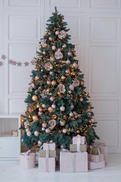 Christmas tree in a beautiful interior with decor festive background of the new year