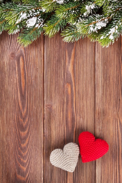 Christmas tree branch with heart toys