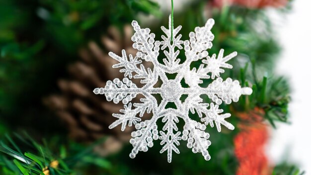 Christmas tree branches decorated with a Xmas snowflake