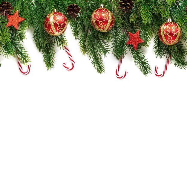 Christmas tree branches with decoration isolated on white background Seamless New Year's Card