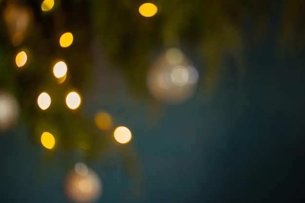 Christmas tree branches with lights out of focus