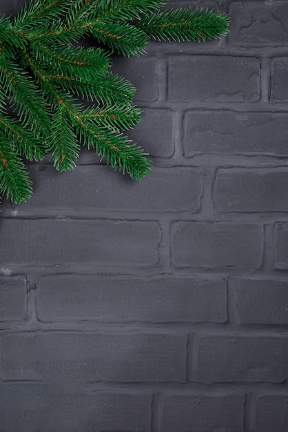 Christmas tree on brick wall background