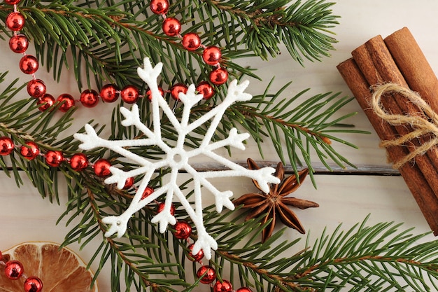 Christmas tree, cinnamon, beads and snowflake 