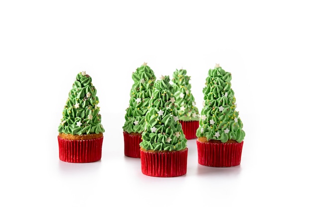 Christmas tree cupcakes isolated on white background