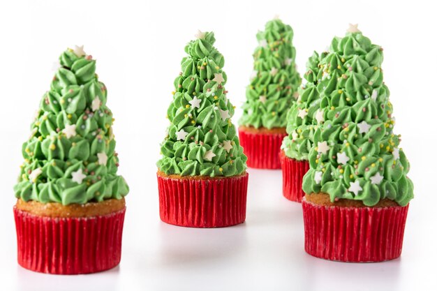 Christmas tree cupcakes isolated on white background