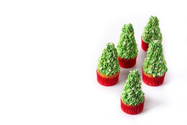 Christmas tree cupcakes isolated on white background