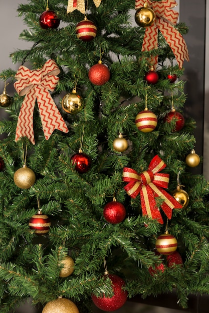 Christmas tree in daylight, with a city landscape