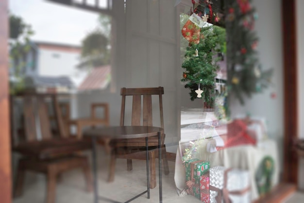 Christmas tree decor on the window of a wooden house