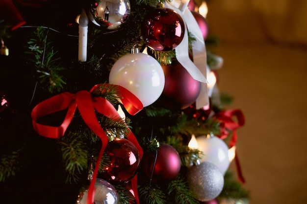 Christmas tree decorated white and red balloons