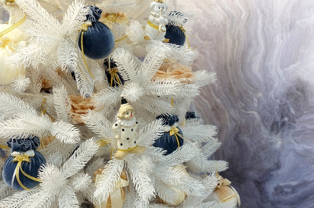 Christmas tree decorated with balls and a clown figurine