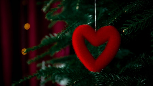 Christmas tree decorated with heart shaped toy and copy space