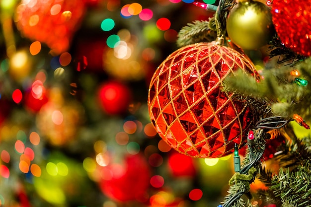 Christmas tree decorated with multicolor ornaments.