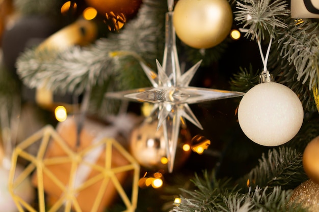 Christmas tree decoration close up background. Garland, balls, illuminated lights. Merry Christmas and Happy New year