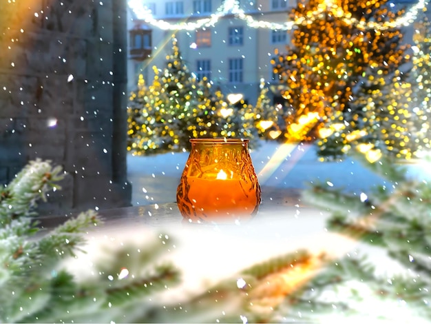 Christmas tree decoration and lantern candle light in snowy festive blurred tree in Tallinn