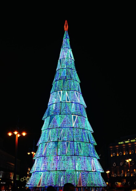 Christmas tree decoration in a modern city center at night