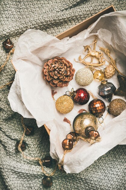 Christmas tree decoration toys balls and pine cones in box