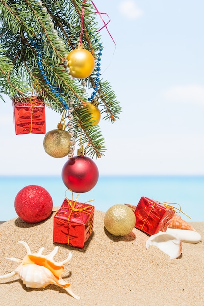 Christmas tree decorations on the beach in tropical. new year holiday in hot countries