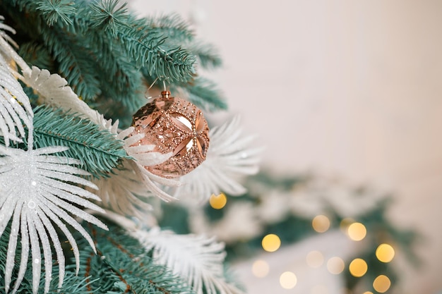 The Christmas tree is decorated for Christmas Beautifully decorated house with silver white and Christmas tree and presents A magical time New Year