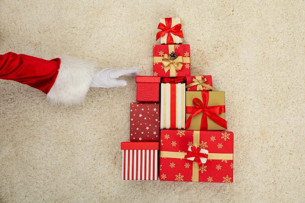 A Christmas tree is laid out with gifts