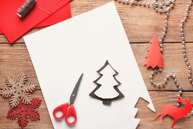 Christmas tree made of felt on table. Concept of handicraft with child