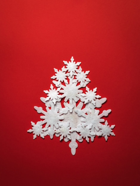 Christmas tree made of paper snowflakes. Christmas and new year holidays.