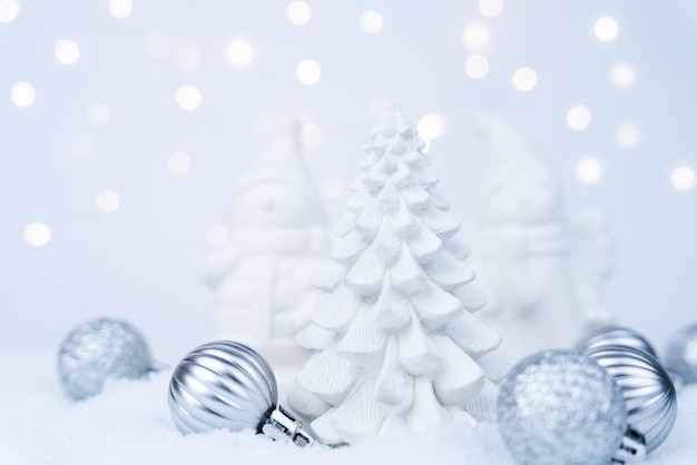 Christmas tree made of plaster and Christmas decorations on snowy background New Year card Closeup Selective focus