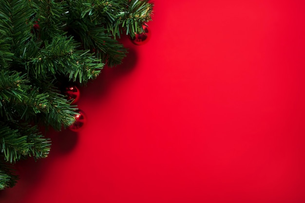 Christmas tree on red background with copy space