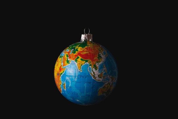 Christmas tree toy in the form of a globe or planet Earth Environmental protection concept