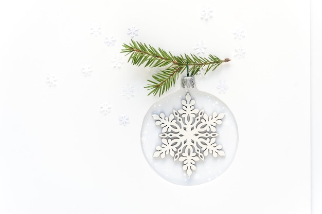 Christmas tree toy made of wooden snowflake on white background