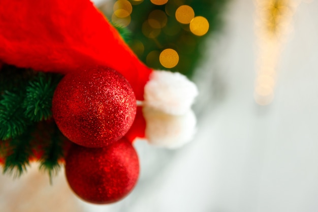 Christmas tree toy and spruce branch are reflected on mirror