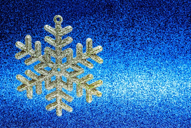 Christmas tree toysnowflake on a shiny background