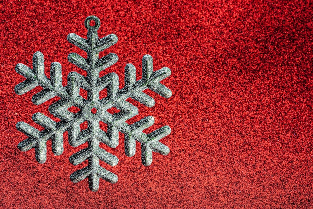 Christmas tree toysnowflake on a shiny background