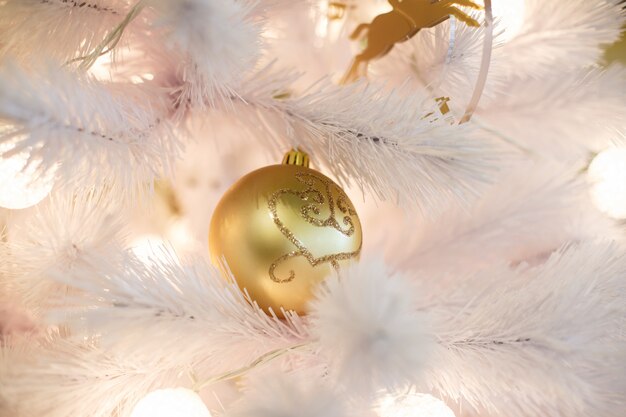 Christmas tree with golden balls.  New Year celebration background. 