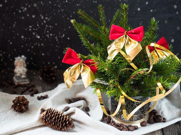 Christmas tree with red bows, December winter holiday Christmas decoration.