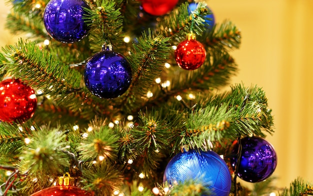 Christmas tree with red toys. 