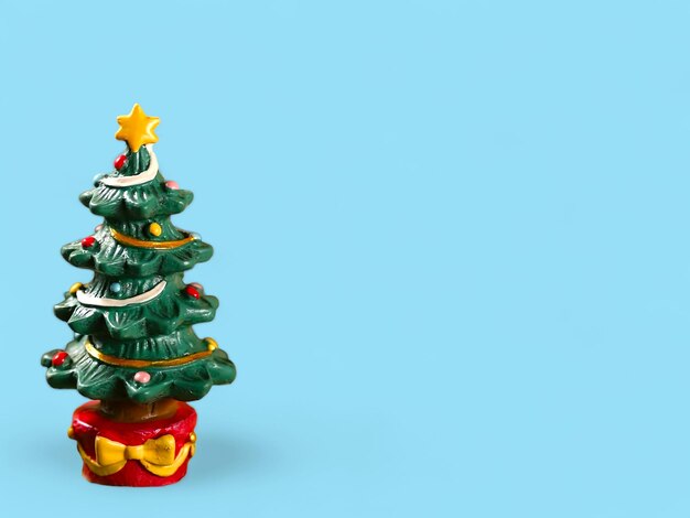 A christmas tree with a star on it with blue background