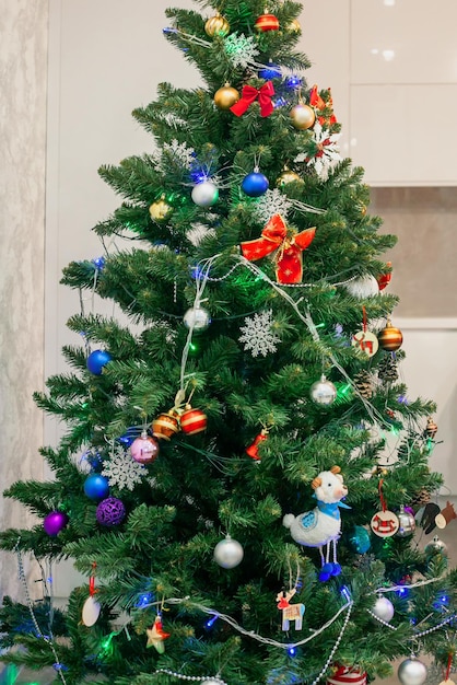 Christmas tree with toys in the apartment